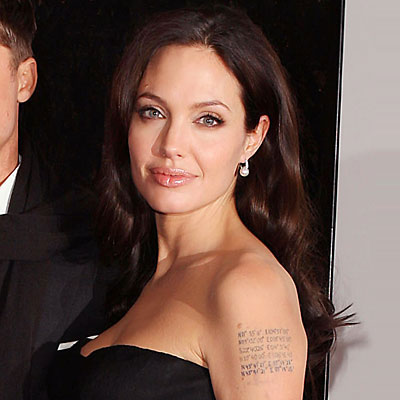 Angelina Jolie's left arm used to bear a picture of a snake and the name of 